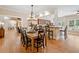 Open dining room features hardwood floors, stylish light fixture, and a view of the living room at 425 Chadwick Pl, Canton, GA 30114