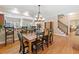 Open dining room with hardwood floors, stylish chairs, and natural lighting at 425 Chadwick Pl, Canton, GA 30114