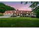 Beautiful exterior view of home with a red roof and inviting front porch at twilight at 425 Chadwick Pl, Canton, GA 30114
