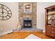 Close up of a stone fireplace with a mantel, hearth, and decorative accents in the living room at 425 Chadwick Pl, Canton, GA 30114