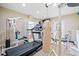 Well-equipped home gym featuring a treadmill, punching bag, and weightlifting equipment at 425 Chadwick Pl, Canton, GA 30114