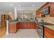 This kitchen boasts granite countertops, stainless appliances, and wooden cabinetry at 425 Chadwick Pl, Canton, GA 30114