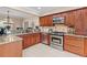 The kitchen showcases granite countertops, stainless steel appliances, and wood cabinets at 425 Chadwick Pl, Canton, GA 30114