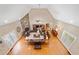 Aerial view of living room with stone fireplace, hardwood floors, and leather furniture at 425 Chadwick Pl, Canton, GA 30114