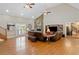 Bright living room with hardwood floors, vaulted ceiling, stone fireplace, and plenty of seating at 425 Chadwick Pl, Canton, GA 30114