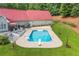 Aerial view of a backyard with an in-ground pool, diving board, and a spacious deck area at 425 Chadwick Pl, Canton, GA 30114