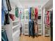 Spacious walk-in closet with custom shelving and window for natural light at 425 Chadwick Pl, Canton, GA 30114