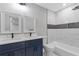 Beautiful bathroom with double vanity, shower and tub combination at 679 Creek View Dr, Lawrenceville, GA 30044