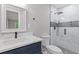 Modern bathroom with marble tile and dark fixtures at 679 Creek View Dr, Lawrenceville, GA 30044