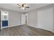Bedroom with hardwood floors, closet, and en suite bathroom at 679 Creek View Dr, Lawrenceville, GA 30044