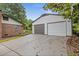 Paved driveway leading to a two-car garage, offering ample parking and convenient access to the house at 679 Creek View Dr, Lawrenceville, GA 30044