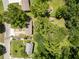 Aerial shot of a property with mature trees, a spacious yard, and a detached garage at 2172 Se Wakita Se Dr, Marietta, GA 30060