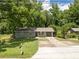 Exterior of single story home with an attached garage and a well-maintained front lawn at 2172 Se Wakita Se Dr, Marietta, GA 30060