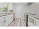 Modern kitchen with stainless steel appliances, white cabinets, and granite countertops at 2172 Se Wakita Se Dr, Marietta, GA 30060