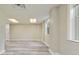 Finished room featuring laminate flooring, a drop ceiling, and multiple windows at 2172 Se Wakita Se Dr, Marietta, GA 30060