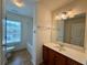 Bathroom with vanity, toilet and bathtub and natural light from the window at 3389 Rosecliff Trce, Buford, GA 30519