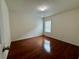 Bright bedroom with hardwood flooring, neutral walls and one large window for natural light at 3389 Rosecliff Trce, Buford, GA 30519