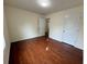Cozy bedroom with hardwood floors, neutral walls, and ample natural light at 3389 Rosecliff Trce, Buford, GA 30519