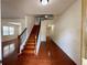 Bright entryway showcasing hardwood floors and staircase leading to the second floor at 3389 Rosecliff Trce, Buford, GA 30519