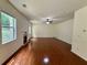 Bright and airy living room with fireplace, hardwood floors, and large windows at 3389 Rosecliff Trce, Buford, GA 30519