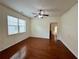 Spacious living room with hardwood floors, a ceiling fan, and access to a private outdoor space at 3389 Rosecliff Trce, Buford, GA 30519