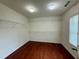 Spacious walk-in closet with hardwood floors, wire shelving, and natural light at 3389 Rosecliff Trce, Buford, GA 30519