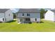Expansive backyard featuring well-maintained lawn, perfect for outdoor activities and relaxation at 625 Kimberwick Dr, Locust Grove, GA 30248