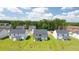 Areal view of a manicured backyard with new home construction in the background at 625 Kimberwick Dr, Locust Grove, GA 30248