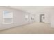 Bright, carpeted bedroom with white walls and two large windows, offering a serene space at 625 Kimberwick Dr, Locust Grove, GA 30248