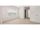Cozy bedroom with carpet, featuring a window and doorway, providing a relaxing retreat at 625 Kimberwick Dr, Locust Grove, GA 30248