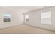 Large bedroom with carpet, featuring multiple windows providing ample natural light at 625 Kimberwick Dr, Locust Grove, GA 30248