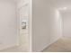 Neutral-toned hallway leading to other rooms at 625 Kimberwick Dr, Locust Grove, GA 30248