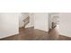 Spacious home interior with hardwood floors, staircase, and an open layout to other rooms at 625 Kimberwick Dr, Locust Grove, GA 30248