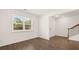 Bright, airy living room with large windows offering natural light and hardwood floors throughout at 625 Kimberwick Dr, Locust Grove, GA 30248
