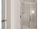 Beautiful shower with marble-style tile, glass enclosure, and modern fixtures at 625 Kimberwick Dr, Locust Grove, GA 30248