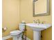 Charming half-bathroom features a pedestal sink and a framed mirror, creating a functional space at 2610 Chadwick Rd, Marietta, GA 30066