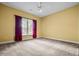 Spacious bedroom features plush carpeting, ceiling fan, and large windows at 2610 Chadwick Rd, Marietta, GA 30066