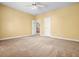 Bedroom with neutral walls, plush carpet, and an access door at 2610 Chadwick Rd, Marietta, GA 30066