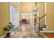 Grand foyer featuring tile floors, high ceilings, and staircase leading to the second floor at 2610 Chadwick Rd, Marietta, GA 30066