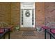 Charming front entrance featuring a decorative wreath on the door, brick accents, and a welcome mat at 2610 Chadwick Rd, Marietta, GA 30066