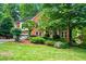 Charming two-story brick home with a well-manicured lawn and lush landscaping at 2610 Chadwick Rd, Marietta, GA 30066