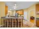Open kitchen features a breakfast bar, oak cabinets, tile floors, and stainless steel appliances at 2610 Chadwick Rd, Marietta, GA 30066