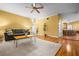 Open-concept living room with hardwood floors, a comfortable couch, and access to the kitchen at 2610 Chadwick Rd, Marietta, GA 30066