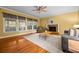 Inviting living room featuring a cozy fireplace, hardwood floors, and large windows for ample light at 2610 Chadwick Rd, Marietta, GA 30066