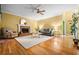 Spacious living room with a brick fireplace, plush seating, and a ceiling fan for comfort at 2610 Chadwick Rd, Marietta, GA 30066