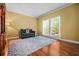 Comfortable living room with neutral paint, wood floors, sofa, and large windows at 2610 Chadwick Rd, Marietta, GA 30066