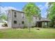 Exterior view of backyard featuring a deck, patio, and nicely landscaped lawn at 3006 Alberta Dr, Marietta, GA 30062
