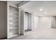Finished basement space featuring built-in shelving, neutral carpeting, and closet with bi-fold doors at 3006 Alberta Dr, Marietta, GA 30062