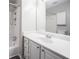 Bathroom featuring neutral paint and carpet, as well as a shower and vanity at 3006 Alberta Dr, Marietta, GA 30062