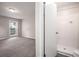 Bathroom featuring a walk-in shower, neutral paint, and a window view to the bedroom at 3006 Alberta Dr, Marietta, GA 30062